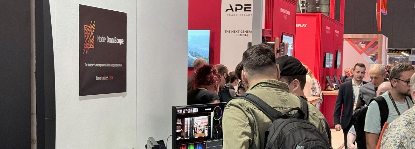 The Time in Pixels booth at IBC, with a Nobe OmniScope poster and a monitor running scopes
